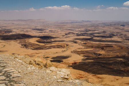 Viewpoint from Mitzpe Ramon village on the huge crater in Negev desert of Israel, hiking in Israel, geological treasure of Israeli natureの写真素材