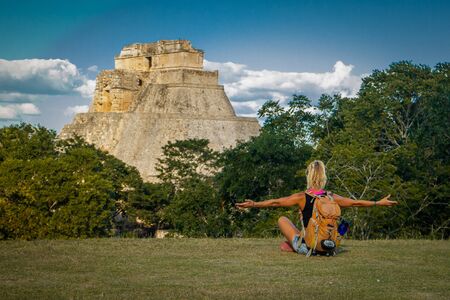 Freedom of backpacking lifestyle in Uxmal ruins in Mexico, european girl visiting mexico, travel...