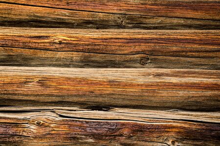 old wall of the house of logs in the villageの写真素材