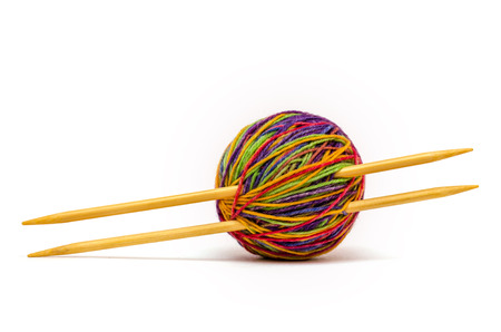 colorful yarn ball pierced wooden needlesの写真素材