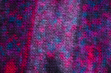Handknitted fabric of colored mohair yarn. Handmade concept