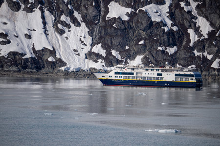Tourists navigate near Mendenhall Glacier's icebergs in Alaska.の写真素材