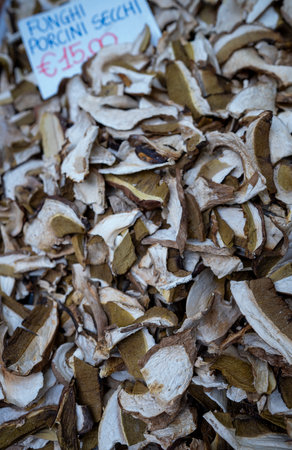 Fresh dried porcini mushrooms for sale in a market stallの写真素材