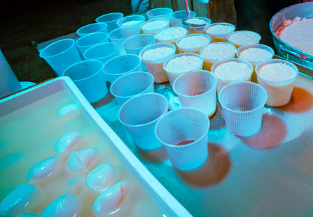 Various cups filled with treats sit on a table.の写真素材