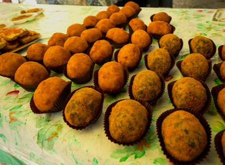 A variety of Italian snacks are neatly arranged for sale at a market.の写真素材