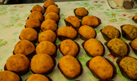 Traditional Italian snacks displayed at a vibrant food market.の写真素材