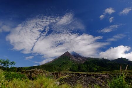 a volcano and savana in bright day