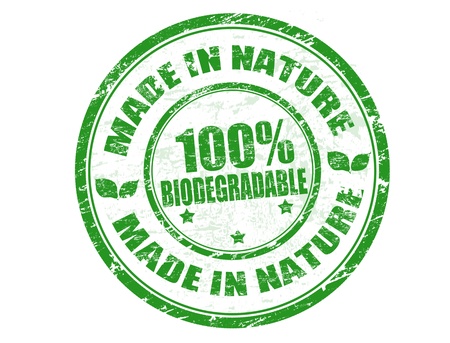 Green grunge rubber stamp with the text Made in Nature - 100% Biodegradable written inside, vector illustrationのイラスト素材