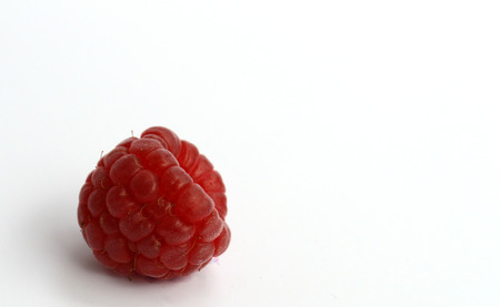 Ripe red raspberry isolated on white backgroundの写真素材