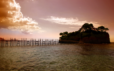 A bridge to the Cameo island at beautiful sunset in Zakynthos island, Greeceの写真素材