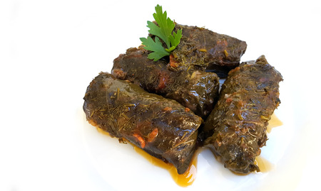 Stuffed Mediterranean vine leaves, or dolmades on white backgroundの写真素材