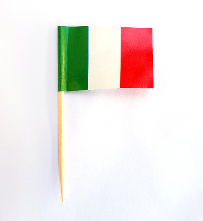 Miniature paper flag pointer Italy on white backgroundの写真素材