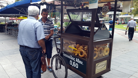 Katerini, Greece - August 27, 2018: Turkish Bagel Simit on sale on food cart in Katerini pedestrian...