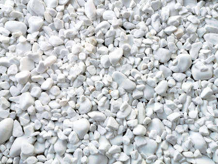 Decorative small white pebbles stone background textureの写真素材