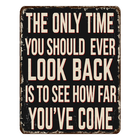 The only time you should ever look back, is to see how far you've come vintage rusty metal sign on a white background, vector illustrationのイラスト素材