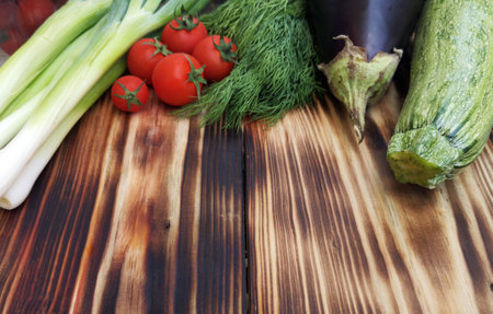 Different fresh vegetables  on wooden backgroundの写真素材