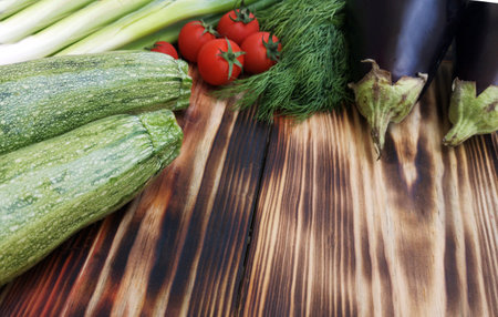 Different fresh vegetables  on wooden backgroundの写真素材