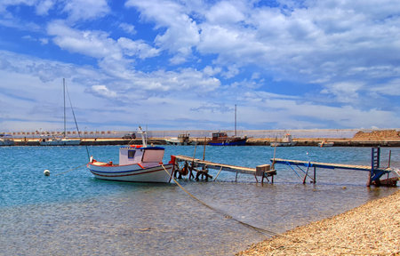 Greece. Traditional fishing boat in clear blue water. Amazing seascape viewの写真素材