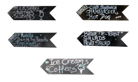 Different beach bar menus written on chalkboard indicating direction isolated on white backgroundの写真素材