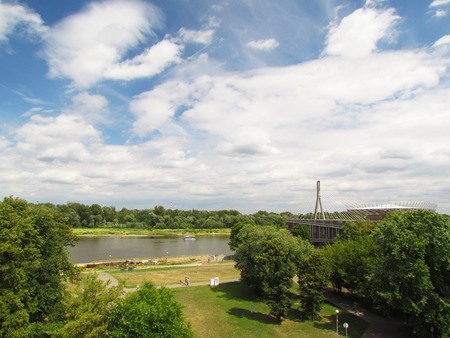 View from the park in the city of Warsaw, houses, buildings, skyの写真素材