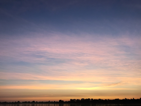 the orange summer sunrise on the riverの写真素材