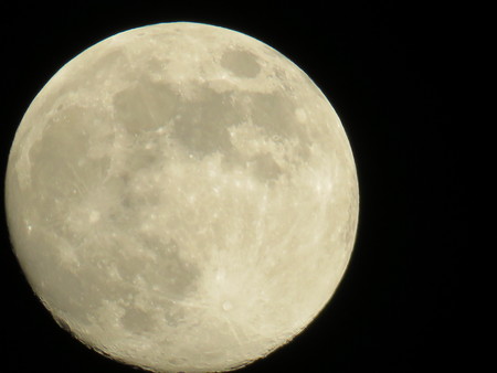 big moon in the night sky without cloudsの写真素材