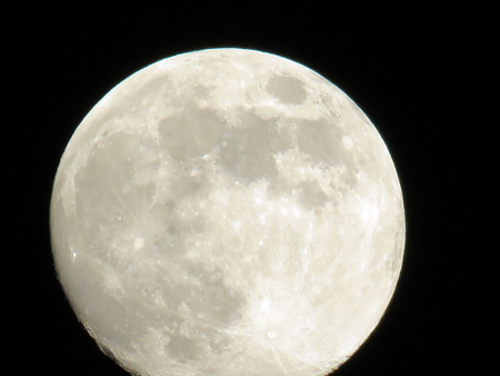 big moon in the night sky without cloudsの写真素材