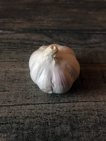 a large white garlic is lying on a tableの写真素材