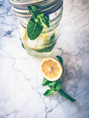 a jar with a refreshing lemonade and mintの写真素材