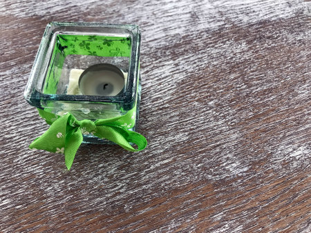 the candle in a glass candleholder with Green bowの写真素材