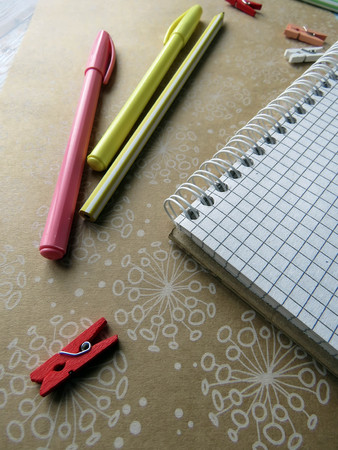 the notebook, pens, pencils and ruler on the tableの写真素材