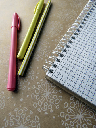 the notebook, pens, pencils and ruler on the tableの写真素材