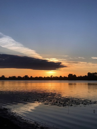 The beautiful summer dawn on the riverの写真素材