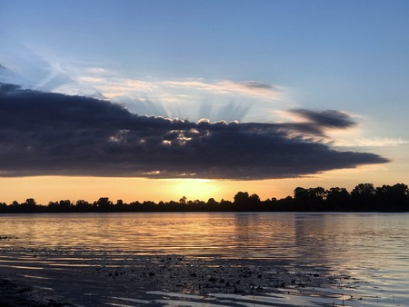 The beautiful summer dawn on the riverの写真素材