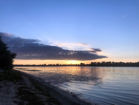 The beautiful summer dawn on the riverの写真素材
