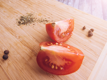 red and yellow tomatoes sliced on a wooden board. healthy eating. eco-friendly products. Organic Food. Style Top View Group Objectsの写真素材