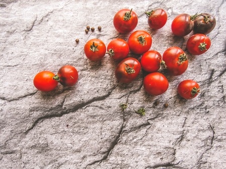 red tomatoes on a wooden board. healthy eating. eco-friendly products. Organic Food. Style Top View Group Objectsの写真素材