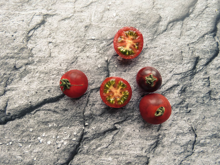 red tomatoes on a wooden board. healthy eating. eco-friendly products. Organic Food. Style Top View Group Objectsの写真素材
