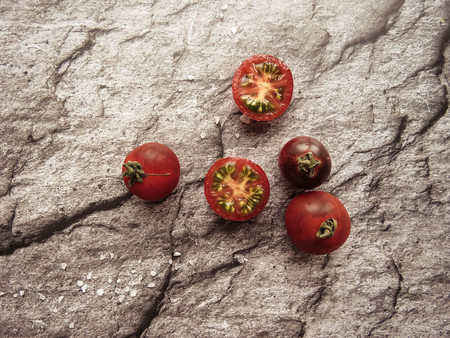 red tomatoes on a wooden board. healthy eating. eco-friendly products. Organic Food. Style Top View Group Objectsの写真素材