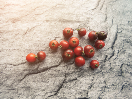 red tomatoes on a wooden board. healthy eating. eco-friendly products. Organic Food. Style Top View Group Objectsの写真素材