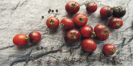 red tomatoes on a wooden board. healthy eating. eco-friendly products. Organic Food. Style Top View Group Objectsの写真素材