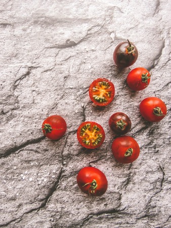 red tomatoes on a wooden board. healthy eating. eco-friendly products. Organic Food. Style Top View Group Objectsの写真素材
