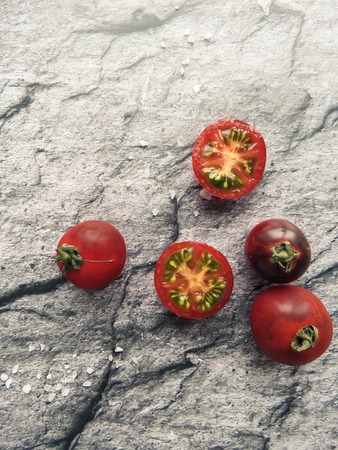 red tomatoes on a wooden board. healthy eating. eco-friendly products. Organic Food. Style Top View Group Objectsの写真素材