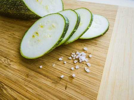 zucchini sliced on a wooden board. healthy eating. eco-friendly products. Organic Food. Style Top View Group Objectsの写真素材