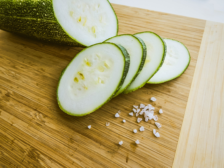 zucchini sliced on a wooden board. healthy eating. eco-friendly products. Organic Food. Style Top View Group Objectsの写真素材