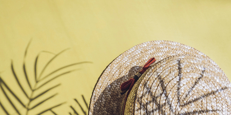 Holiday, vacation tropical beach from above - palm tree leaves and a straw hat. seashells. Style Top View Group Objectsの写真素材