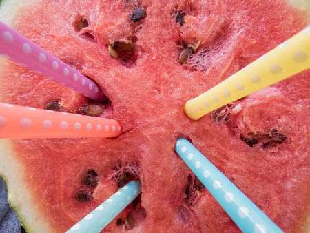 ripe red watermelon with colorful tubules Summer food background healthy eating. eco-friendly products. organic fruits. copyspace. Organic Food. Style Top Viewの写真素材