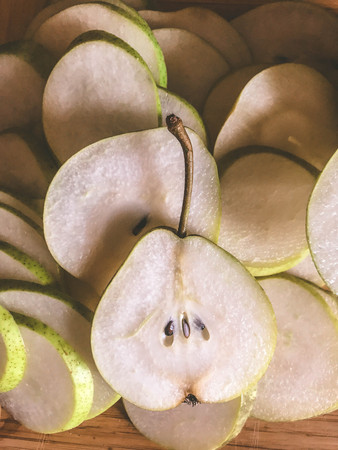 Fresh ripe organic pears on rustic wooden table, natural background, vega, diet food.の写真素材