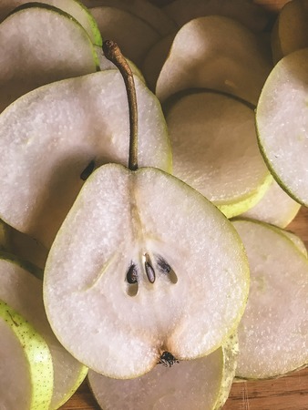 Fresh ripe organic pears on rustic wooden table, natural background, vega, diet food.の写真素材