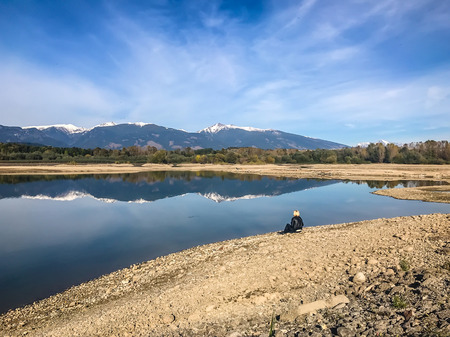 The lake with clear turquoise water is surrounded by mountains. Liptovska Mara Slovakia. The concept of ecological and active tourism. Autumn in nature. Octoberの写真素材